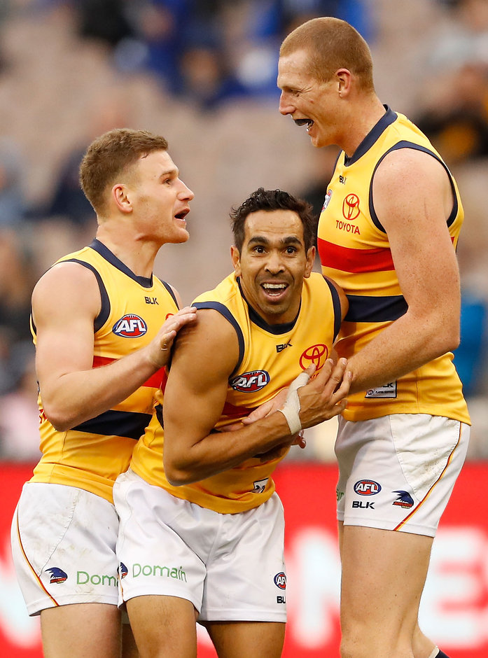 AFL 2016 Rd 16 - Carlton v Adelaide MELBOURNE, AUSTRALIA - JULY 10: Sam Jacobs of the Crows celebrates a goal with Eddie Betts and Rory Laird of the Crows during the 2016 AFL Round 16 match between the Carlton Blues and the Adelaide Crows at the Melbourne Cricket Ground on July 10, 2016 in Melbourne, Australia. (Photo by Adam Trafford/AFL Media)